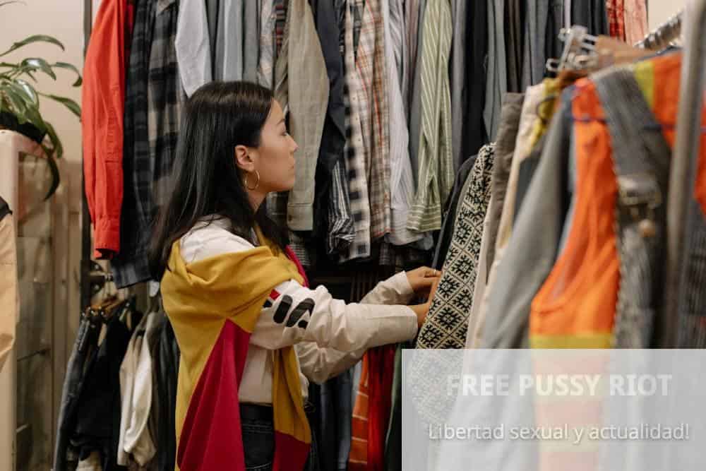 Woman in Yellow Long Sleeve Shirt Holding White and Black Scarf