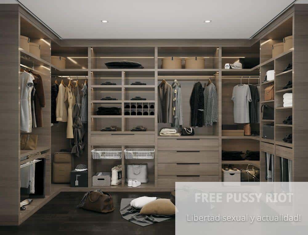 a walk in closet filled with lots of clothes